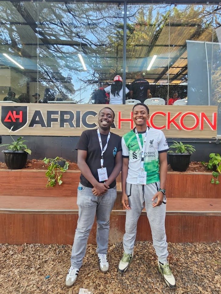 Duo at AfricaHackon sign